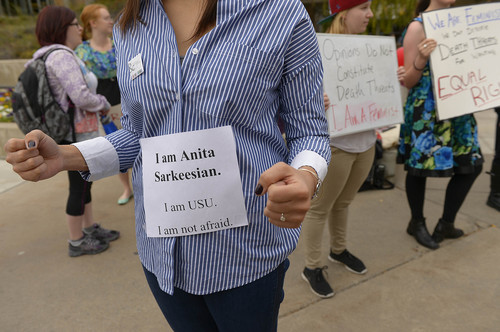 Leah Hogsten  |  The Salt Lake Tribune
Asher Puriri, showing her support for Sarkeesian at the rally, said she believes that there is more misogyny and anti-feminist attitudes on campus than most realize.  Utah State University students and faculty rallied in support of feminist writer Anita Sarkeesian, who was supposed to address the campus until an author of an email threatened bloody mayhem on the campus if she was allowed to speak, Wednesday, October 15, 2014, outside the Glen Taggart Student Center on the campus of Utah State University.  Sarkeesian cancelled her appearance on both the threat -- and a state law that allows conceal-carry permit holders to be armed at events in public venues.
