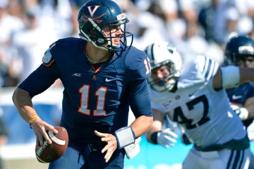 Chris Detrick  |  The Salt Lake Tribune
Virginia Cavaliers quarterback Greyson Lambert (11) looks to pass the ball during the second half of the game at LaVell Edwards Stadium Saturday September 20, 2014.  BYU won the game 41-33.