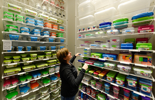 Francisco Kjolseth  |  The Salt Lake Tribune
Allison Copeland, corporate office visual sales training manager who is normally based in Coppell, Texas, makes sure everything is straight and perfect for the 10,000 products available at the new Container Store. The store is set to open at Fashion Place Mall on Saturday, will be the first in Utah and number 68 for the popular nationwide chain that specializes in all things storage and organizing ideas for every room in the house.