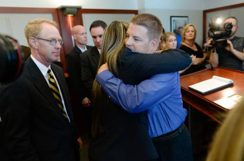 Francisco Kjolseth  |  The Salt Lake Tribune
Former West Valley City police officer Shaun Cowley gets a hug from his defense attorney Lindsay Jarvis after hearing from Judge L.A. Dever that he will not have to stand trial on Thursday, Oct. 9, 2014. Cowley was being charged with second-degree felony manslaughter in connection with the Nov. 2, 2012 fatal shooting of 21-year-old Danielle Willard.