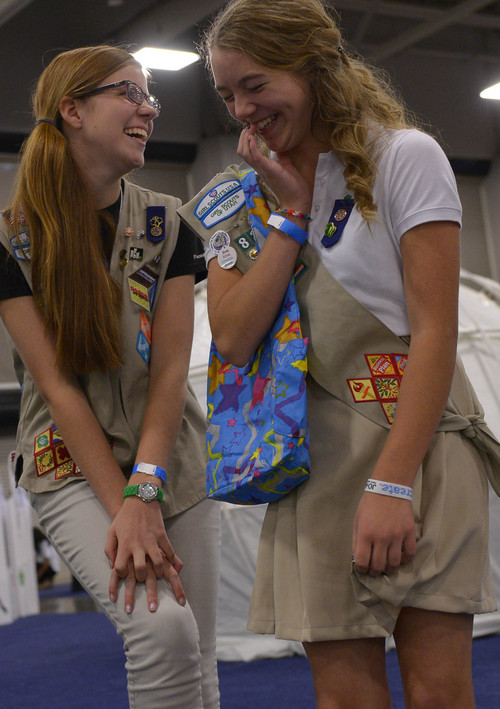 Leah Hogsten  |  The Salt Lake Tribune
Kaatje Fisk, left, and Betty Coon giggle as they play an interactive game Thursday at the National Girl Scout Convention at the Salt Palace Convention Center in Salt Lake City. The ìHall of Experiences,î part of the convention, includes more than 70 interactive and educational activities including Women of the Harlem Globetrotters, LPGA mini-golf, the U.S. Space and Rocket Center camp and a 25-foot-high treehouse.