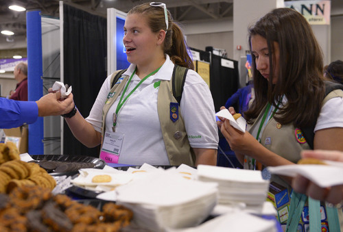 Leah Hogsten  |  The Salt Lake Tribune
Hailey Mowell of Gresham, Oregon snags a Girl Scout cookie at the National Girl Scout Convention at the Salt Palace Convention Center in Salt Lake, October 16, 2014. The "Hall of Experiences," part of the National Girl Scout Convention, includes more than 70 interactive and educational activities including women of the Harlem Globetrotters, LPGA mini-golf, the U.S. Space and Rocket Center camp and a 25-foot-high treehouse.