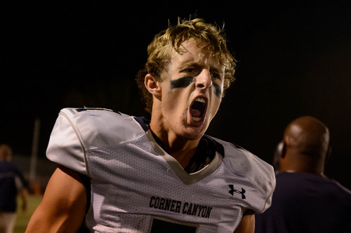 Trent Nelson  |  The Salt Lake Tribune
Corner Canyon quarterback Michael Ebeling celebrates after diving into the end zone for a two-point conversion and the win over Woods Cross High School football, in Woods Cross, Wednesday October 15, 2014.