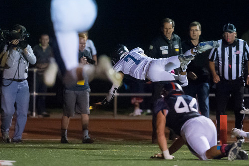 Trent Nelson  |  The Salt Lake Tribune
Corner Canyon quarterback Michael Ebeling dives into the end zone for a two-point conversion and the win over Woods Cross High School football, in Woods Cross, Wednesday October 15, 2014.