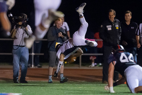 Trent Nelson  |  The Salt Lake Tribune
Corner Canyon quarterback Michael Ebeling dives into the end zone for a two-point conversion and the win over Woods Cross High School football, in Woods Cross, Wednesday October 15, 2014.