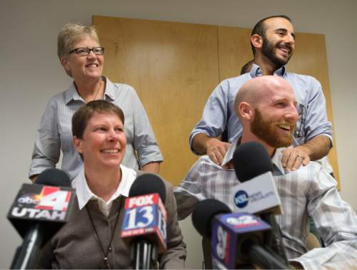 Steve Griffin  |  The Salt Lake Tribune


Excited couples Laurie Wood, top left, and Kody Partridge, and Moudi Sbeity, top right, and Derek Kitchen address the media during press conference at Magleby and Greenwood law offices in Salt Lake City, Monday, October 6, 2014.
