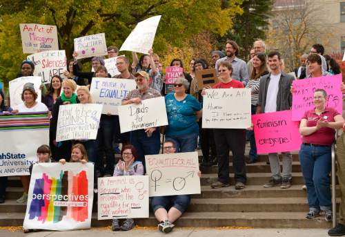 Leah Hogsten  |  The Salt Lake Tribune
Utah State University students and faculty rallied in support of feminist writer Anita Sarkeesian, who was supposed to address the campus until an author of an email threatened bloody mayhem on the campus if she was allowed to speak, Wednesday, October 15, 2014 outside the Glen Taggart Student Center on the campus of Utah State University.  Sarkeesian cancelled her appearance on both the threat -- and a state law that allows conceal-carry permit holders to be armed at events in public venues.