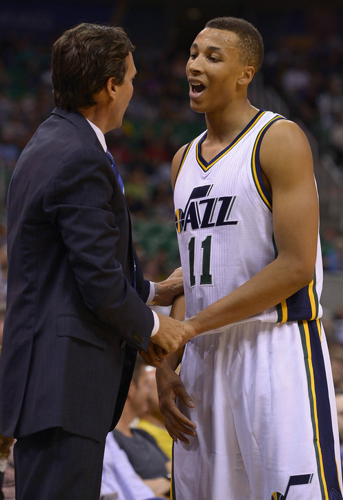 Leah Hogsten  |  The Salt Lake Tribune
Utah Jazz guard Dante Exum (11) reacts to Utah Jazz head coach Quin Snyder's words as he comes off the court. Utah Jazz defeated the Portland Blazers 92-73 during Tuesday's, October 7, 2014 preseason opener at Energy Solutions Arena.