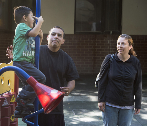 Rick Egan  |  The Salt Lake Tribune

Tony and Cynthia Martinez, play with their  4-year-old son, Adrian,  on the playground at the Road Home shelter, Friday, October 10, 2014
