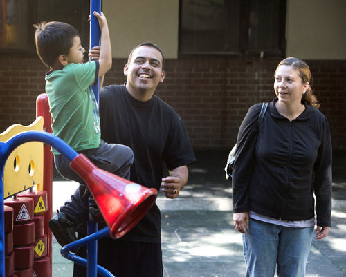 Rick Egan  |  The Salt Lake Tribune

Tony and Cynthia Martinez, play with their  4-year-old son, Adrian,  on the playground at the Road Home shelter, Friday, October 10, 2014