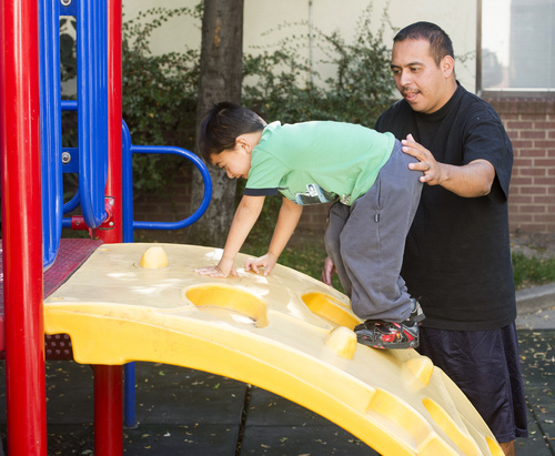 Rick Egan  |  The Salt Lake Tribune

Tony Martinez, plays  his 4-year-old son, Adrian, on the playground at the Road Home shelter, Friday, October 10, 2014