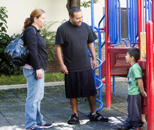 Rick Egan  |  The Salt Lake Tribune

Tony and Cynthia Martinez, play with their  4-year-old son, Adrian,  on the playground at the Road Home shelter, Friday, October 10, 2014