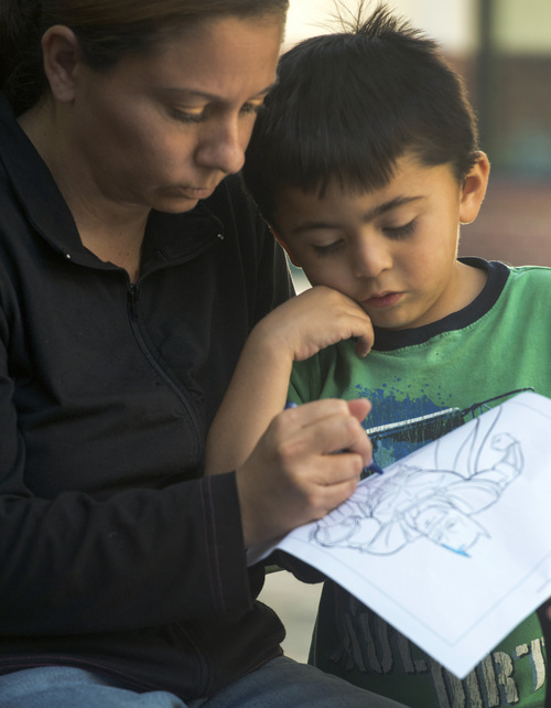 Rick Egan  |  The Salt Lake Tribune

 Cynthia Martinez, with her 4-year-old son, Adrian, at the Road Home shelter, Friday, October 10, 2014