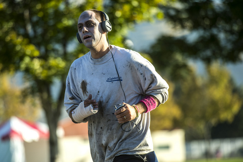 Chris Detrick  |  The Salt Lake Tribune
Scenes from the Dawn of the Running Dead 5K race at the Utah State Fairpark Saturday October 18, 2014.