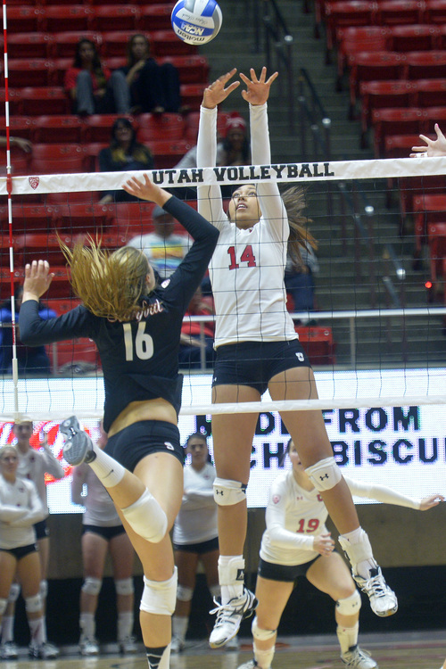 Chris Detrick  |  The Salt Lake Tribune
Utah outside hitter Adora Anae (14) goes to block the ball from Stanford outside hitter Brittany Howard (16) during the game at The Huntsman Center Sunday October 19, 2014.
