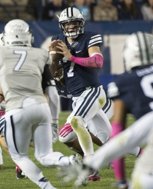 Rick Egan  |  The Salt Lake Tribune

Brigham Young Cougars quarterback Christian Stewart (7) looks for an open man, as he scrambles with the ball, in football action, BYU vs The Nevada Wolf Pack at Lavell Edwards Stadium, Saturday, October18, 2014