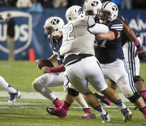Rick Egan  |  The Salt Lake Tribune

Brigham Young Cougars quarterback Christian Stewart (7) runs with the ball seconds before fumbling it with 39 seconds left in BYU vs The Nevada Wolf Pack at LaVell Edwards Stadium, Saturday, October18, 2014