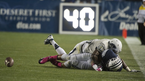 Rick Egan  |  The Salt Lake Tribune

Nevada Wolf Pack defensive back Randy Uzoma (31) strips the ball from Brigham Young Cougars wide receiver Terenn Houk (11), which Nevada recovered, in football action, BYU vs The Nevada Wolf Pack at LaVell Edwards Stadium, Saturday, October18, 2014