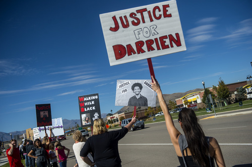 Chris Detrick  |  The Salt Lake Tribune
Family friends of Darrien Hunt and other community members participate in a rally calling for justice in Saratoga Springs Saturday Oct. 18, 2014.  Hunt was fatally shot on Sept. 10 by officers responding to a call about a man with a sword walking down the street.