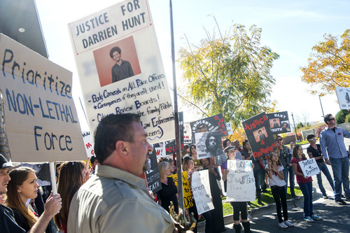 Chris Detrick  |  The Salt Lake Tribune
Family and friends of Darrien Hunt and other community members participate in a rally calling for justice outside of the Saratoga Springs police department Saturday Oct. 18, 2014.  Hunt was fatally shot on Sept. 10 by officers responding to a call about a man with a sword walking down the street.