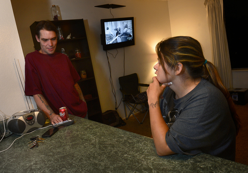 Scott Sommerdorf  |  The Salt Lake Tribune
Joseph Hardy talks with his girlfriend Brandy Gonzalez in his apartment, Friday, October 10, 2014.  Hardy has spent 14 years in jail and prison and has been an intravenous drug user. He's been clean for over a year and is in permanent assisted housing under Utah's Housing First program.