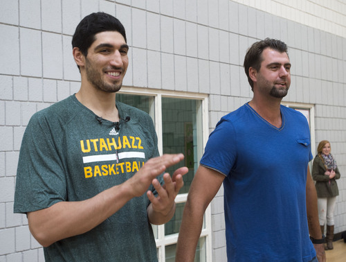 Steve Griffin  |  The Salt Lake Tribune


Turkish legend and former NBA All-Star, and former Utah Jazz player Mehmet Okur, right, and current Utah Jazz player Enes Kanter  are introduced at the Sorenson Multicultural Center in Salt Lake City, Tuesday, October 14, 2014. Kanter was at the center to play basketball and give youth in an after school program tickets which he personally purchased as part of his ongoing participation in the Jazz player ticket donation program.  Okur, a 2007 NBA All-Star, played for the Jazz from 2004-11 and recently joined the team as an ambassador to help with the organization's alumni program, community and fan relations efforts, basketball operations and business development.
