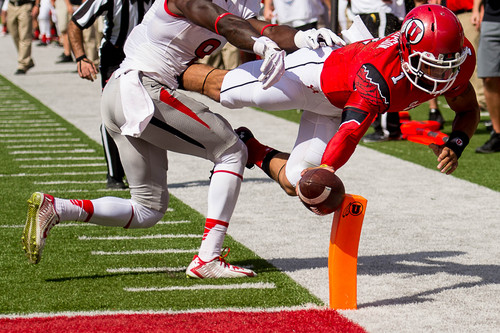 Trent Nelson  |  The Salt Lake Tribune
Utah Utes quarterback Kendal Thompson (1) dives for a touchdown, just ahead of Fresno State Bulldogs defensive back Curtis Riley (9) as Utah hosts Fresno State, college football at Rice-Eccles Stadium Saturday September 6, 2014.