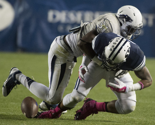 Rick Egan  |  The Salt Lake Tribune

Nevada Wolf Pack defensive back Randy Uzoma (31) strips the ball from Brigham Young Cougars wide receiver Terenn Houk (11), which Nevada recovered, in football action, BYU vs The Nevada Wolf Pack at LaVell Edwards Stadium, Saturday, October18, 2014