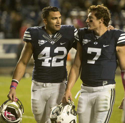 Rick Egan  |  The Salt Lake Tribune

Brigham Young Cougars linebacker Michael Alisa (42) comforts quarterback Christian Stewart (7) after he fumbled the ball with 39 seconds left, as they leave the field after losing to Nevada 42-35 at LaVell Edwards Stadium, Saturday, October18, 2014.