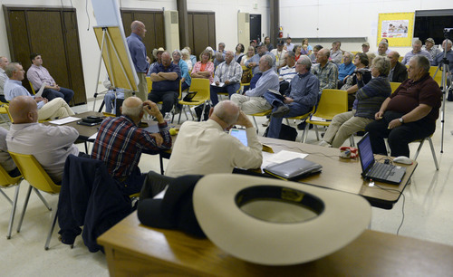 Al Hartmann  |  The Salt Lake Tribune
Residents of western Juab County listen to a U.S. Air Force representative's presentation at a public forum Monday Oct. 20, 2014, at West Desert High School in Partoun to discuss expanding the Utah Test and Training Range.