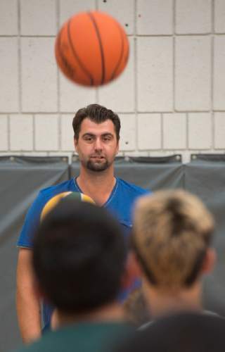 Steve Griffin  |  The Salt Lake Tribune


Turkish legend, former NBA All-Star and former Utah Jazz member, Mehmet Okur works with children, at the Sorenson Multicultural Center, on their basketball skills, in Salt Lake City, Tuesday, October 14, 2014. Okur was at the center with current Utah Jazz player Enes Kanter who was giving youth in an after school program tickets which he personally purchased as part of his ongoing participation in the Jazz player ticket donation program.  Okur, a 2007 NBA All-Star, played for the Jazz from 2004-11 and recently joined the team as an ambassador to help with the organization's alumni program, community and fan relations efforts, basketball operations and business development.