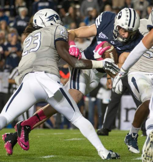 Rick Egan  |  The Salt Lake Tribune

Brigham Young Cougars wide receiver Mitch Mathews (10) gets past Nevada Wolf Pack defensive back Nigel Haikins (23)scores his second touchdown of the night, in football action, BYU vs The Nevada Wolf Pack at Lavell Edwards Stadium, Saturday, October18, 2014