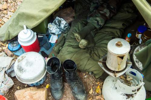 Chris Detrick  |  The Salt Lake Tribune
Eugene Schwarz rests in his tent at his living site near Salt Lake City Saturday October 11, 2014.