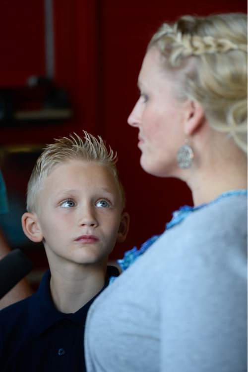 Francisco Kjolseth  |  The Salt Lake Tribune
Heather Moffat, emotionally recounts the day that his son Max, 10, left, rescued his 5-year old brother Miles from a potential near drowning incident this summer. The event took place on July 18 at the Fox Point Old Farm Apartment Complex when Max was able to locate and bring Miles to the surface after the 5-year old slipped under water at a swimming party.