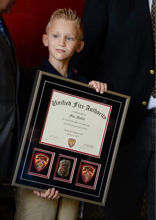 Francisco Kjolseth  |  The Salt Lake Tribune
Unified Fire Authority recognizes 10-year old Max Moffat for his quick action in rescuing his 5-year old brother Miles from a potential near drowning incident this summer. The event took place on July 18 at the Fox Point Old Farm Apartment Complex when Max was able to locate and bring Miles to the surface after the 5-year old slipped under water at a swimming party.