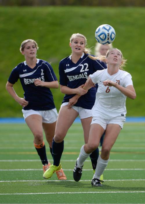 Francisco Kjolseth  |  The Salt Lake Tribune
Olivia Wade of Davis keeps her eye on the ball as Brighton's Tatum Lefler, left, and Gracie Geurts put on the pressure in the 5A girls' soccer semifinal at Juan Diego High School in Draper on Tuesday, Oct. 21, 2014.