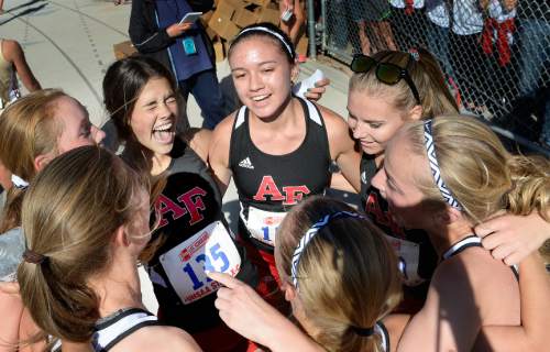 Scott Sommerdorf  |  The Salt Lake Tribune
The American Fork girls team celebrates their upset team win over rival Davis at the Utah State cross-country races held at Sugar House Park and Highland H.S., Wednesday, October 22, 2014.