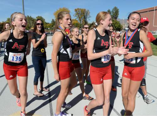 Scott Sommerdorf  |  The Salt Lake Tribune
The American Fork girls team celebrates their win over rival Davis at the Utah State cross-country races held at Sugar House Park and Highland H.S., Wednesday, October 22, 2014.