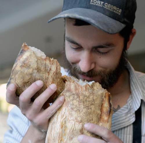 Al Hartmann  |  The Salt Lake Tribune
Ryan Moore smiles as he smells a hot loaf of ciabatta bread just out of the oven. The Utah baker will compete in the first round of the Bread Bakers Guild Team USA competition in Providence, R.I.