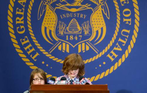 Trent Nelson  |  The Salt Lake Tribune
Riley Hackford-Peer, 12, gets emotional speaking at a press conference in support of same-sex adoption at the State Capitol Building in Salt Lake City, Friday, February 28, 2014. At left is his brother, Casey Hackford-Peer, 7. The Utah Supreme Court on Thursday cleared the way for the Utah Department of Health to issue birth certificates that list the same-sex parents as the children's legal parents.