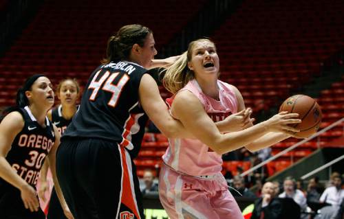 Scott Sommerdorf   |  The Salt Lake Tribune
Utah's Taryn Wicijowski is fouled as she goes tot he basket by OSU's Ruth Hamblin during second half play. Utah beat Oregon State 66-40, Sunday, February 10, 2013.