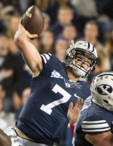 Rick Egan  |  The Salt Lake Tribune

Cougar quarterback Christian Stewart (7) throws a pass for BYU  in football action, BYU vs The Nevada Wolf Pack at Lavell Edwards Stadium, Saturday, October18, 2014