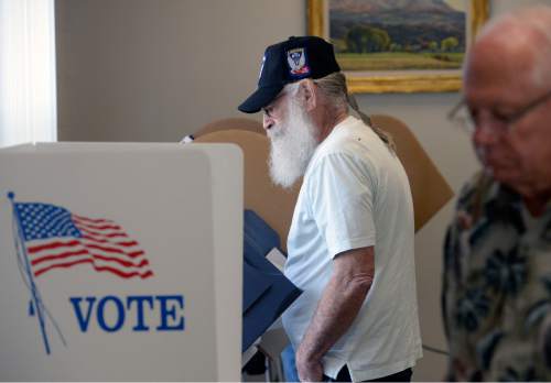 Al Hartmann  |  The Salt Lake Tribune
Army veteran Dail Sullivan is first in line to vote early at the River Bend Senior Center in Salt Lake City  Tuesday October 21, 2014.  Voting was brisk at the poll which opened at 10 a.m. The early vote started Tuesday and continues through Halloween.
