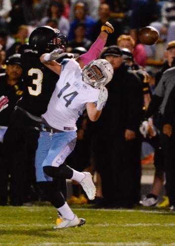 Francisco Kjolseth  |  The Salt Lake Tribune
Roy's Cody Hobbs, #3, breaks up a pass intended for Sky View's Jr Saxton, #14, in game action on Thursday, Oct. 23, 2014, at Roy High School.