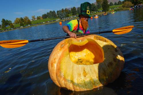 Trent Nelson  |  The Salt Lake Tribune
Bryan Bennett comes to shore at the 4th Annual Ginormous Pumpkin Regatta in Sugar House Park, Salt Lake City, Saturday October 18, 2014.