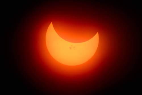 Trent Nelson  |  The Salt Lake Tribune
A partial solar eclipse, seen from the Natural History Museum of Utah in Salt Lake City, Thursday October 23, 2014.