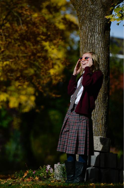 Francisco Kjolseth  |  The Salt Lake Tribune
Cambria Duncan, 10, uses special glasses to see the partial solar eclipse after hearing about it in school on Thursday, Oct. 23, 2014.