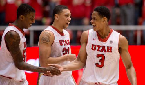 Lennie Mahler  |  The Salt Lake Tribune
Delon Wright, Jordan Loveridge and Princeton Onwas celebrate after Wright tossed an alley-oop dunk to Onwas in the second half as the Utes led against the Colorado Buffaloes at the Huntsman Center, Saturday, March 1, 2014.