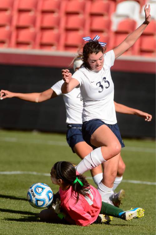 Trent Nelson  |  The Salt Lake Tribune
Waterford's KitKat Morrill (33) collides with Rowland Hall goalkeeper Alyssa Cole (21) as Rowland Hall defeats Waterford in the 2A girls' high school soccer state championship game at Rio Tinto Stadium in Sandy, Saturday October 25, 2014.