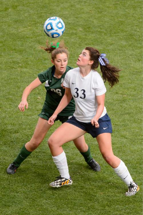 Trent Nelson  |  The Salt Lake Tribune
Waterford's KitKat Morrill (33) looks to the ball as Rowland Hall defeats Waterford in the 2A girls' high school soccer state championship game at Rio Tinto Stadium in Sandy, Saturday October 25, 2014. Rowland Hall's Kaela Gilbert (26) at left.